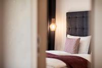 Posteľ alebo postele v izbe v ubytovaní SOFTALPIN Garden Suites