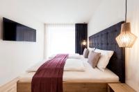 Posteľ alebo postele v izbe v ubytovaní SOFTALPIN Garden Suites