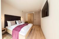 Posteľ alebo postele v izbe v ubytovaní SOFTALPIN Garden Suites