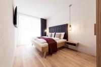 Posteľ alebo postele v izbe v ubytovaní SOFTALPIN Garden Suites