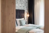 Posteľ alebo postele v izbe v ubytovaní SOFTALPIN Garden Suites