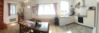 a kitchen with a table and a window in it at Gîte &quot;Entre fraises et mer&quot; in Landrethun-lès-Ardres