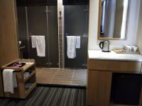 a bathroom with a shower and a sink at In Young Hotel in Kaohsiung
