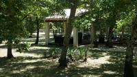 a park with trees and a gazebo at Clos l&#39;Oustal in Labastide-de-Virac