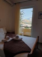 Postel nebo postele na pokoji v ubytování Drosia Hotel