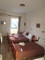 Postel nebo postele na pokoji v ubytování Drosia Hotel