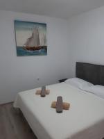 Postel nebo postele na pokoji v ubytování Apartman Noah