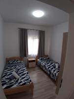 Postel nebo postele na pokoji v ubytování Apartman Noah