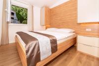 Posteľ alebo postele v izbe v ubytovaní Apartments Kricin II