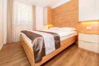 Posteľ alebo postele v izbe v ubytovaní Apartments Kricin II