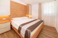 Posteľ alebo postele v izbe v ubytovaní Apartments Kricin II