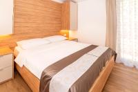 Posteľ alebo postele v izbe v ubytovaní Apartments Kricin II