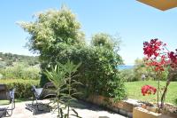 A garden outside Domus Carlotta Apartment with sea view Villasimius
