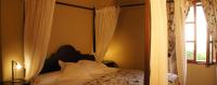 Łóżko lub łóżka w pokoju w obiekcie Petit Hotel Alaro