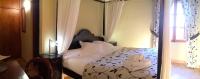 Łóżko lub łóżka w pokoju w obiekcie Petit Hotel Alaro