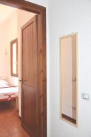 A bed or beds in a room at Domus Carlotta Apartment with sea view Villasimius