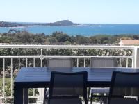 a blue table and chairs on a balcony with the ocean at I Casetti in Molini