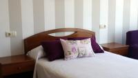 Posteľ alebo postele v izbe v ubytovaní Apartamentos Timón Puerto