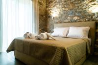 Posteľ alebo postele v izbe v ubytovaní Petras Gi - Stone Houses