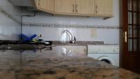 Kuchyňa alebo kuchynka v ubytovaní Apartamentos Timón Puerto