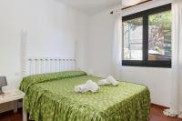 A bed or beds in a room at La Quinta Punyeta