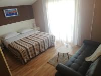 Postel nebo postele na pokoji v ubytování Apartments Mira