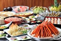a buffet of different types of food on a table at Kurobe Kanko Hotel in Omachi