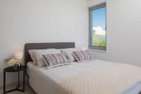 Postel nebo postele na pokoji v ubytování Luxury Design Beach Front Apartment