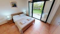 Postel nebo postele na pokoji v ubytování Villa Athina