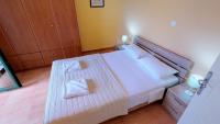 Postel nebo postele na pokoji v ubytování Villa Athina