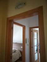 A bed or beds in a room at ÁTICO EN RIBEIRA(centro)