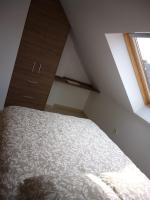 A bed or beds in a room at ÁTICO EN RIBEIRA(centro)