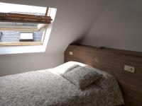 A bed or beds in a room at ÁTICO EN RIBEIRA(centro)