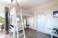 Posteľ alebo postele v izbe v ubytovaní Naiada Stomio-A apartment