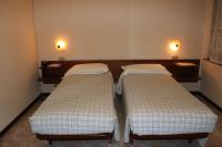 A bed or beds in a room at Albergo Napoleone