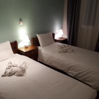 A bed or beds in a room at Cactus