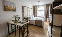 Postel nebo postele na pokoji v ubytování Letna Garden Suites