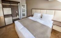 Postel nebo postele na pokoji v ubytování Letna Garden Suites