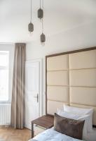 Postel nebo postele na pokoji v ubytování Letna Garden Suites