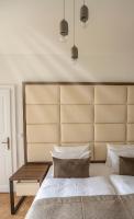 Postel nebo postele na pokoji v ubytování Letna Garden Suites