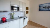 Kuchyň nebo kuchyňský kout v ubytování Letna Garden Suites