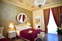 A bed or beds in a room at Palazzo degli Affreschi