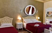 A bed or beds in a room at Palazzo degli Affreschi