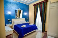 A bed or beds in a room at Palazzo degli Affreschi