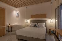 Posteľ alebo postele v izbe v ubytovaní Central Suites Mykonos
