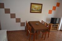 Telewizja i/lub zestaw kina domowego w obiekcie Apartments Denis & Lucija