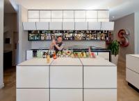 a man behind a counter in a kitchen at NU Hotel in Brooklyn