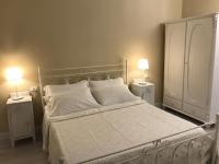 Posteľ alebo postele v izbe v ubytovaní B&B Da Patty