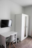 Televízia a/alebo spoločenská miestnosť v ubytovaní Apartmani Žužić