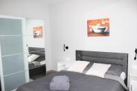 Posteľ alebo postele v izbe v ubytovaní Apartmani Žužić